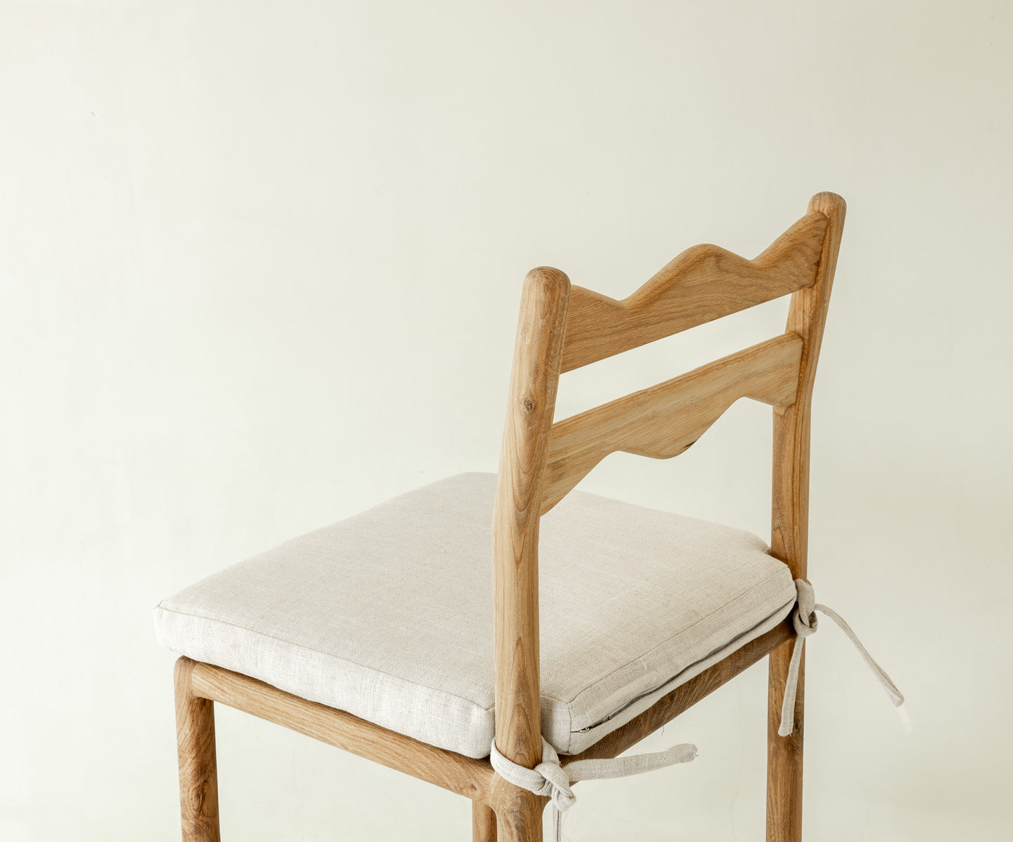 Jasper Solid Oak Dining Chair in natural colour way with cushion - close up angel of the backrest