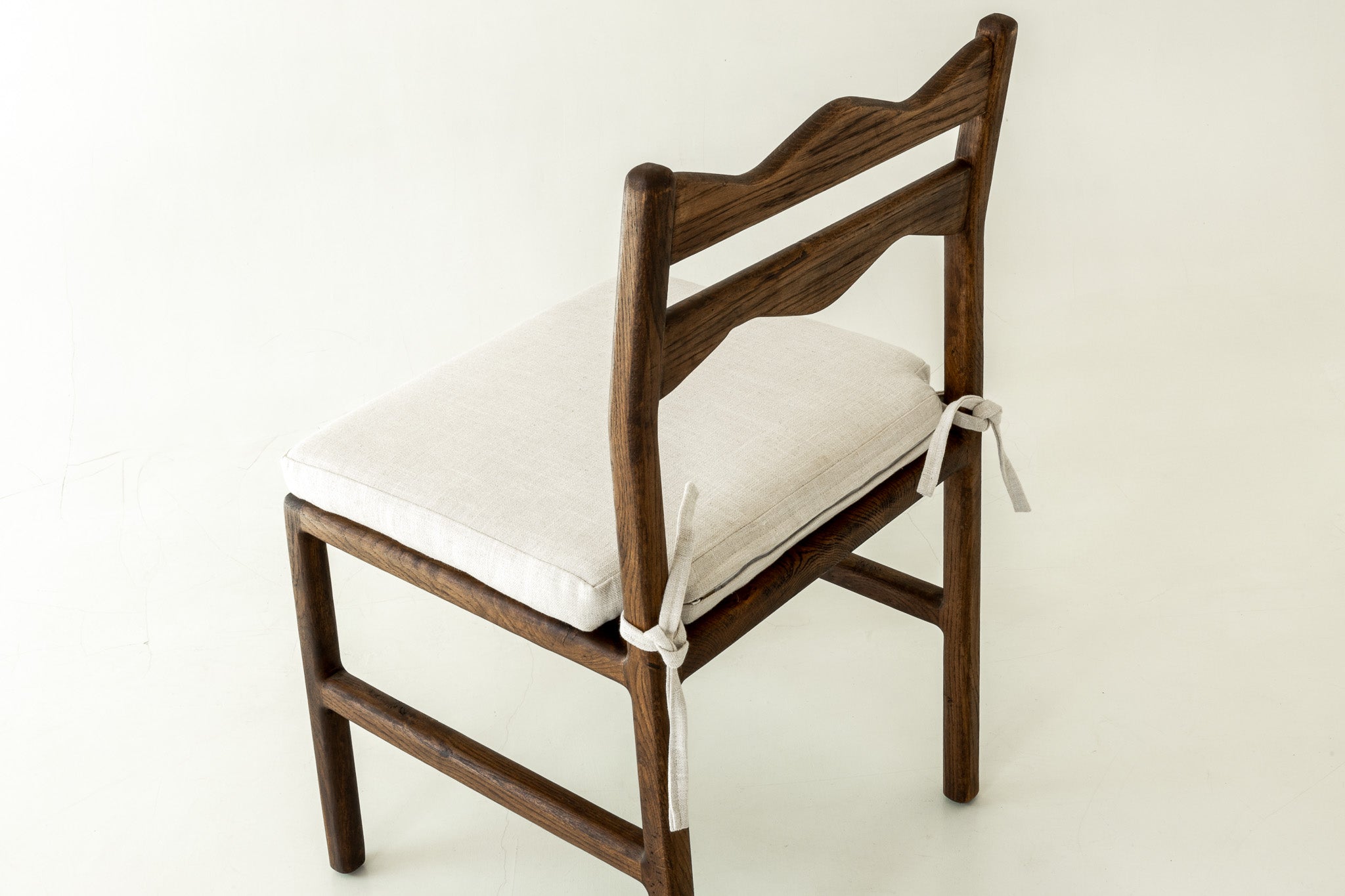 Jasper Solid Oak Dining Chair In Chocolate Colour Way With Cushion - Close Up Angle Of The Backrest 