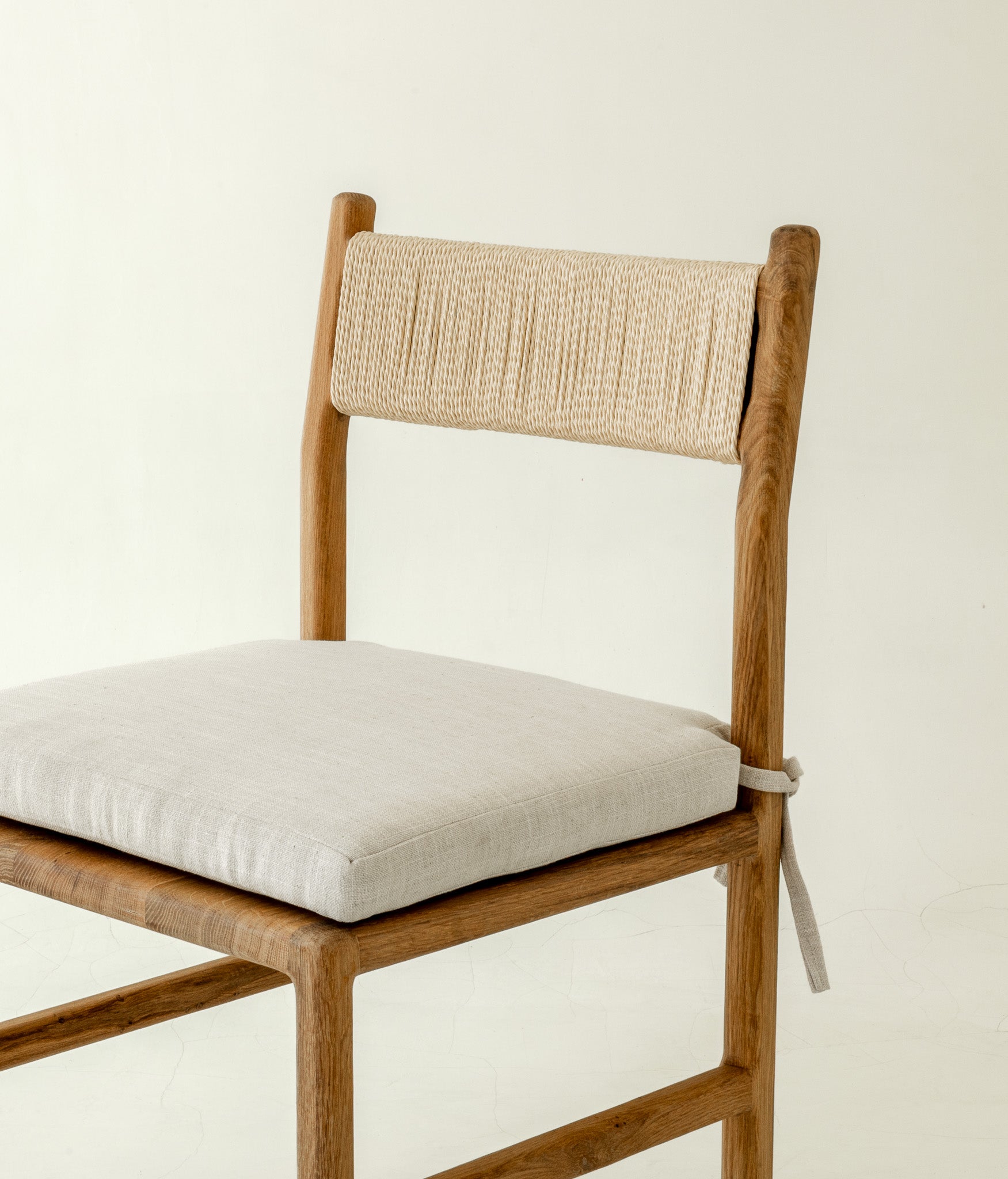 Nara Solid Oak Dining Chair with pillow - close up front angle 