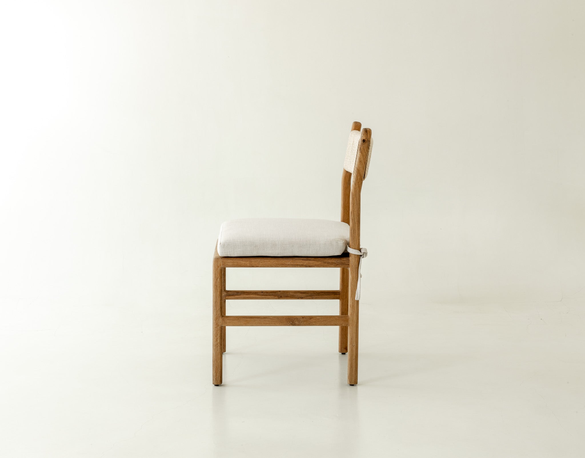 Nara Solid Oak Dining Chair with pillow - side angle 